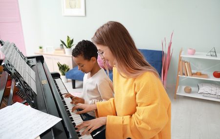 How to Keep Kids Engaged with Piano Play this Summer